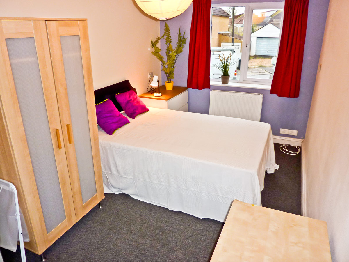 Bedroom 3, large double room with windows at each end